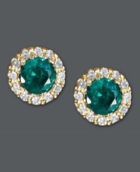Put the green in your glamour. Effy Collection's dazzling button stud earrings feature round-cut emeralds (3/4 ct. t.w.) surrounded by halos of round-cut diamonds (1/8 ct. t.w.). Crafted in a 14k gold post setting. Approximate diameter: 1/4 inch. Put the green in your glamour. Effy Collection's dazzling button stud earrings feature round-cut emeralds (3/4 ct. t.w.) surrounded by halos of round-cut diamonds (1/8 ct. t.w.). Crafted in a 14k gold post setting. Approximate diameter: 1/4 inch.