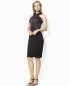 A timeless sheath rendered in sleek satin, this dress has an elegant crossover neckline and figure-flattering silhouette, making it the perfect Little Black Dress for any occasion.