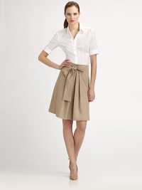 A crisp poplin skirt featuring a flattering silhouette and a self-tie belt that creates an ultra-feminine bow.Self-tie bow beltPleated front centerConcealed back zipperAbout 23 longCottonDry cleanImported Model shown is 5'11 (180cm) wearing US size 4. A crisp poplin skirt featuring a flattering silhouette and a self-tie belt that creates an ultra-feminine bow.Self-tie bow beltPleated front centerConcealed back zipperAbout 23 longCottonDry cleanImported Model shown is 5'11 (180cm) wearing US size 4.