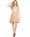 Bar III Front Row's ladylike lace dress lets a pop of bold color peek out around the hem of a fit-and-flare silhouette.