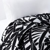 Keep it simple...or dress it up with color. This collection is white on black in a bold print. Leaves of giant grass grace this soft cotton duvet, complementing any modern bedroom.