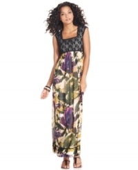A lacy bodice contrasts the feminine floral print and crinkled texture of the skirt of ECI's latest maxi. A lacy bodice contrasts the feminine floral print and crinkled texture of the skirt of ECI's latest maxi.