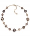 Lightweight yet luxe. Carolee's illusion necklace will have an elegant effect on your fall wardrobe. Made in gold tone mixed metal, it's adorned with glass pearls in a beautiful brown hue as well as sparkling fireball accents. Approximate length: 16 inches + 2-inch extender.