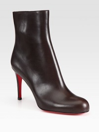 Shapely leather bootie with back seam detail and sculpted stiletto.Self-covered heel, 3½ (90mm) Shaft, 5¼ Leg circumference, 9½ Round toe Inside zip Leather lining Padded insole Signature red leather sole Made in ItalyOUR FIT MODEL RECOMMENDS ordering one half size up as this style runs small. Shapely leather bootie with back seam detail and sculpted stiletto.Self-covered heel, 3½ (90mm) Shaft, 5¼ Leg circumference, 9½ Round toe Inside zip Leather lining Padded insole Signature red leather sole Made in ItalyOUR FIT MODEL RECOMMENDS ordering one half size up as this style runs small.