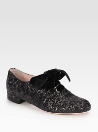 An oversized velvet bow adorns this glittery on-the-go essential. Glitter-coated fabric upperLeather lining and solePadded insoleMade in ItalyOUR FIT MODEL RECOMMENDS ordering true size. 