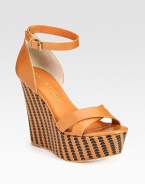 Luscious leather upper elevated by a woven wedge and platform. Self-covered wedge, 5 (125mm)Covered platform, 2 (50mm)Compares to a 3 heel (75mm)Leather upperLeather lining and solePadded insoleImportedOUR FIT MODEL RECOMMENDS ordering one half size up as this style runs small. 