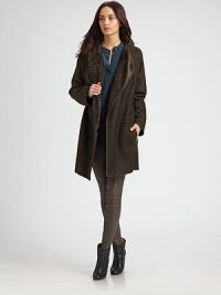 Supple shearling, slightly elongated in a draped open front style.Foldover lapelsLong sleevesOpen frontSlash pocketsAbout 34 from shoulder to hemShearlingDry clean by a fur specialistImportedModel shown is 5'11 (180cm) wearing US size Small. Supple shearling, slightly elongated in a draped open front style.Foldover lapelsLong sleevesOpen frontSlash pocketsAbout 34 from shoulder to hemShearlingDry clean by a fur specialistImportedModel shown is 5'11 (180cm) wearing US size Small.