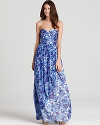 Decorated in painterly posies, This floor-sweeping Shoshanna gown embrace the season's floral-print trend in vibrant style. Decorated in painterly posies, This floor-sweeping Shoshanna gown embrace the season's floral-print trend in vibrant style.