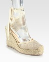 Semi-sheer floral lace and wrap-around ties add feminine style to this woven design, lifted by a textured espadrille wedge. Covered wedge, 4 (100mm)Covered platform, 1 (25mm)Compares to a 3 heel (75mm)Lace and woven fabric upper with leather trimLeather liningRubber trek solePadded insoleMade in Italy