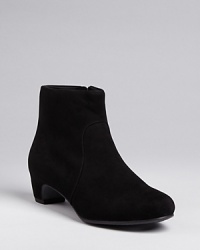 Simply stylish, these Eileen Fisher booties are perfectly streamlined, with elegantly sculpted heels that define the design. Simply stylish, these Eileen Fisher booties are perfectly streamlined, with elegantly sculpted heels that define the design.