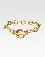Bold, textured links in a gleaming gold finish have an ornate toggle closure. 18k goldplated Length, about 7½ Toggle closure with CRYSTALLIZED - Swarovski Elements accents Made in USA