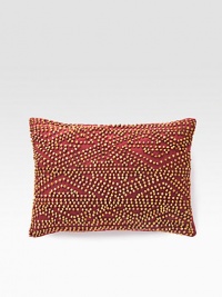 A rustic, wholly exotic pillow is defined by wood beads that add depth and texture wherever you place it.12 X 16Beaded cottonSpot cleanImported