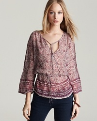 Infuse your look with the eclectic stylings of this silk Joie top, lending a worldly look to your staple black pants and favorite skinny jeans. Perfect as we segue into spring, the airy silhouette lends trend-right appeal to your every day. Infuse your look with the eclectic stylings of this silk Joie top, lending a worldly look to your staple black pants and favorite skinny jeans. Perfect as we segue into spring, the airy silhouette lends trend-right appeal to your every day.