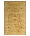 Lavish your space in timeless tradition, set in soft, earthy shades on this exquisite area rug from Safavieh. Tufted in India from pure wool, this rug emerges from the annals of antiquity to bring spectacular style and time-honored quality to your home. (Clearance)