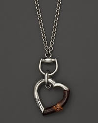 Sterling silver and bamboo heart necklace by Gucci. Sterling silver and bamboo heart necklace by Gucci.