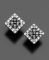 The chic contrast of round-cut black diamonds (1/8 ct. t.w.) and white diamonds (1/10 ct. t.w.) delivers dramatic eye-catching style. Stud earrings set in 14k white gold. Approximate diameter: 1/4 inch.