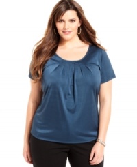 A pleated neckline lends a sophisticated accent to Jones New York Collection's short sleeve plus size top-- dress it up with trousers or down with denim. A pleated neckline lends a sophisticated accent to Jones New York Collection's short sleeve plus size top-- dress it up with trousers or down with denim.