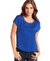Neon laced trim adds a punch of brightness to this boldly blue Kensie top -- perfectly paired with denim!