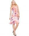 A tropical floral print gets a little abstract and rendered in a modern color palette in this Calvin Klein Jeans dress.