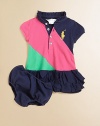 Preppy drop-waist polo silhouette in boldly colorblocked stretchy cotton is accented with a pretty ruffled skirt and matching bloomers.Ruffled stand collarShort puffed sleevesButton frontDrop-waistRuffled hemCottonMachine washImported Please note: Number of buttons may vary depending on size ordered. 