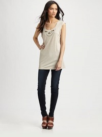 A thoroughly modern cut and beautiful beaded embellishment at the neckline make this top a must-have.Wide band at round necklineShort sleevesLonger tunic lengthAbout 24 from shoulder to hem55% cotton/45% modalDry cleanImported A thoroughly modern cut and beautiful beaded embellishment at the neckline make this top a must-have.Wide band at round necklineShort sleevesLonger tunic lengthAbout 24 from shoulder to hem55% cotton/45% modalDry cleanImported