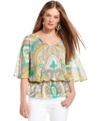 This retro-inspired INC petite top is ultra-fashionable! The peplum waist, cape sleeves and pretty print create a look that's totally on-trend. This retro-inspired INC petite top is ultra-fashionable! The peplum waist, cape sleeves and pretty print create a look that's totally on-trend.