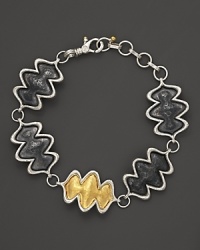 A 24K yellow gold flame stands out against sterling silver on Gurhan's Flame bracelet.