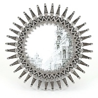 Evoking images of the New York City Chrysler building, this Olivia Riegel Art Deco sunburst frame is a true classic. Hand-enameling and Swarovski crystals in a silver-tone metal finish. Evoking images of the New York City Chrysler building, this Olivia Riegel Art Deco sunburst frame is a true classic. Hand-enameling and Swarovski crystals in a silver-tone metal finish.