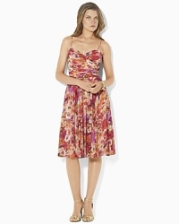 Bright blooms lend breezy vintage charm to a softly ruched surplice dress in airy georgette, finished with a full, sweeping skirt for dramatic movement. Bright blooms lend breezy vintage charm to a softly ruched surplice dress in airy georgette, finished with a full, sweeping skirt for dramatic movement.