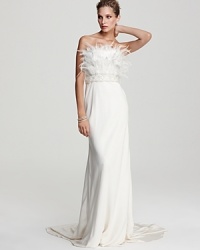 A dramatic flourish of plumes and opulent beading crown this Theia strapless gown of rich silk, finished with an elegant train. A dramatic flourish of plumes and opulent beading crown this Theia strapless gown of rich silk, finished with an elegant train.