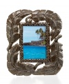 Picture yourself beneath a tropical palm, in this hand-cut, carved and finished frame. Four large fronds crafted of recycled steel and complemented by rich textural detail exemplify the talent and resourcefulness of Haiti's esteemed artisans.