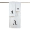 Monogram letter towels: A classic and sophisticated look, this monogrammed collection features a soft, plush oversized 100% combed cotton loop terry towel made of the finest quality materials. Choose from a white towel with a silver metallic embroidered letter of your choice in Bodoni font or an ivory towel with a brown embroidered letter of your choice in Bodoni font. All letters available A - Z.