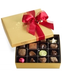 Donned with a soft red bow, this classic collection of Godiva chocolates makes a perfectly sweet and irresistible gift this season in its shimmering gold box. Donned with a soft red bow, this classic collection of Godiva chocolates makes a perfectly sweet and irresistible gift this season in its shimmering gold box.