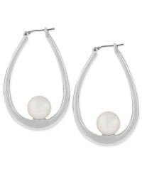 Having a ball. Robert Lee Morris puts simulated plastic pearl accents to stylish effect in this pair of oval hoop earrings. Crafted from silver-tone mixed metal. Approximate drop: 1-3/4 inches. Having a ball. Robert Lee Morris puts simulated plastic pearl accents to stylish effect in this pair of oval hoop earrings. Crafted from silver-tone mixed metal. Approximate drop: 1-3/4 inches.