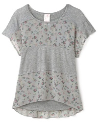 Mixing heathered blocks and floral insets, this chiffon shirt features a solid tank top undershirt built in. Mixing heathered blocks and floral insets, this chiffon shirt features a solid tank top undershirt built in.