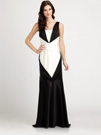 Satiny and sleek, this floor-skimming style features an intriguing front twist and a fishtail hemline.Squared-off U necklineSleevelessFront twist detailV backFishtail hemlineFully linedAbout 42 from natural waist75% triacetate/25% polyesterDry cleanMade in USA of imported fabricModel shown is 5'9 (175cm) wearing US size 4. Satiny and sleek, this floor-skimming style features an intriguing front twist and a fishtail hemline.Squared-off U necklineSleevelessFront twist detailV backFishtail hemlineFully linedAbout 42 from natural waist75% triacetate/25% polyesterDry cleanMade in USA of imported fabricModel shown is 5'9 (175cm) wearing US size 4.