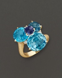 A brilliant cluster of faceted iolite, blue topaz and diamond adds bright color to gleaming 18K yellow gold. By Carelle. A brilliant cluster of faceted iolite, blue topaz and diamond adds bright color to gleaming 18K yellow gold. By Carelle.