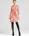 A classic DIANE von FURSTENBERG wrap dress belongs in every woman's closet--this vibrantly-printed DVF statement maker lends a body-hugging fit, designed to flatter from every angle, in a silk jersey knit.