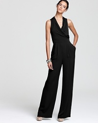 This elegant Catherine Malandrino jumpsuit flaunts pristine tailoring and the season's high-waisted silhouette. The perfect mix of modern and masculine, this piece ensures you make a sophisticated statement. This elegant Catherine Malandrino jumpsuit flaunts pristine tailoring and the season's high-waisted silhouette. The perfect mix of modern and masculine, this piece ensures you make a sophisticated statement.