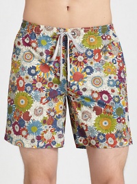 Be ready to hit the beach and beyond in these classic, tailored swim trunks, set in quick-drying, liberty art fabric.Elastic drawstring waistZip flySide slash, back welt pocketsFully linedInseam, about 7NylonMachine washImported Be ready to hit the beach and beyond in these classic, tailored swim trunks, set in quick-drying, liberty art fabric.Elastic drawstring waistZip flySide slash, back welt pocketsFully linedInseam, about 7NylonMachine washImported