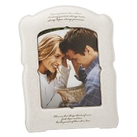 This romantic frame is inscribed with the poignant words from 1 Corinthians 13: Love is patient, love is kind. It always protects, always trusts, always hopes, always perseveres. There are three things that last forever: faith, hope and love. But the greatest of them all is love. The frame makes a memorable engagement, wedding or anniversary gift. Frame holds one 8x10 photo and is crafted of porcelain.Height: 14 1/2 This romantic frame is inscribed with the poignant words from 1 Corinthians 13: Love is patient, love is kind. It always protects, always trusts, always hopes, always perseveres. There are three things that last forever: faith, hope and love. But the greatest of them all is love. The frame makes a memorable engagement, wedding or anniversary gift. Frame holds one 8x10 photo and is crafted of porcelain.Height: 14 1/2