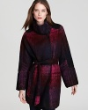 Go dark and decadent in an oversized BASLER coat, brushed with a rich plaid pattern and cinched at the waist for a modern feminine statement.