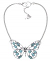 Spread your wings. Fossil's stylish large vintage openwork butterfly features resin and reconstituted turquoise, set in silver tone mixed metal. Approximate length: 13 inches + 2-inch extender. Approximate drop: 2-1/3 inches.