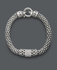 Embrace a little vintage-inspired elegance. This retro bracelet receives a modern touch with a tasteful, thick chain, intricate crisscross pattern, and rows of round-cut diamonds (1/4 ct. t.w.). Crafted in sterling silver. Approximate length: 8-1/2 inches.