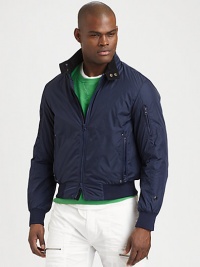 A sporty jacket designed for casual days on the go in water-resistant taffeta with a soft modal-blend lining and light fill. An optional drawcord hood provides extra protection against the elements.