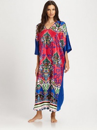 An artistic print defines this colorful design, rendered in signature lightweight fabric. V-neckWide dolman sleevesPullover styleAbout 52 from shoulder to hemPolyesterMachine washImported An artistic print defines this colorful design, rendered in signature lightweight fabric. V-neckWide dolman sleevesPullover styleAbout 52 from shoulder to hemPolyesterMachine washImported
