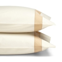 A classic sateen border trims these pillowcases by SFERRA, woven from super soft Egyptian cotton.