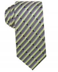 A vibrant print gives this silk tie from Alfani a bright persona. A vibrant print gives this silk tie from Alfani a bright persona.