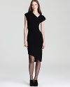 Asymmetric and mesh details lend edgy modernity to a little black dress from Rachel Roy.