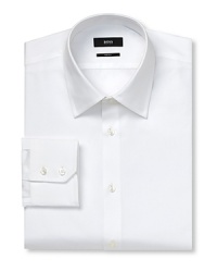 Squarely beveled cuffs with two buttons. Flat back yoke with no pleats. Clean front, no pocket. Rounded hem. Solid broadcloth. Squarely beveled cuffs with two buttons. Flat back yoke with no pleats. Clean front, no pocket. Rounded hem. Solid broadcloth.